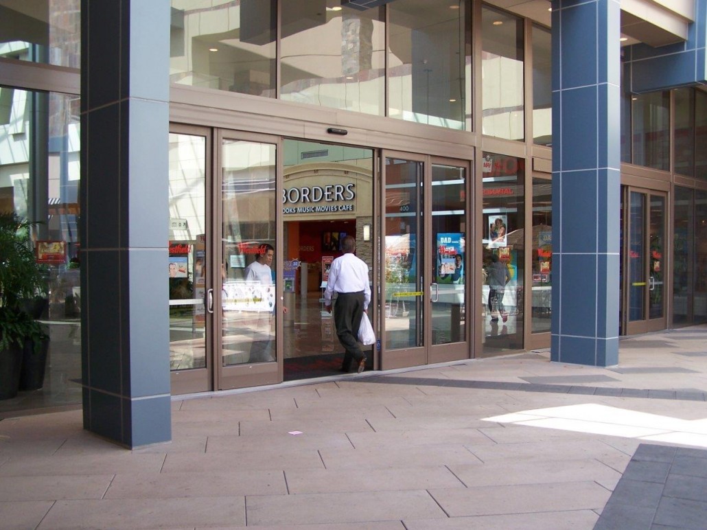 A man entering a commercial building
