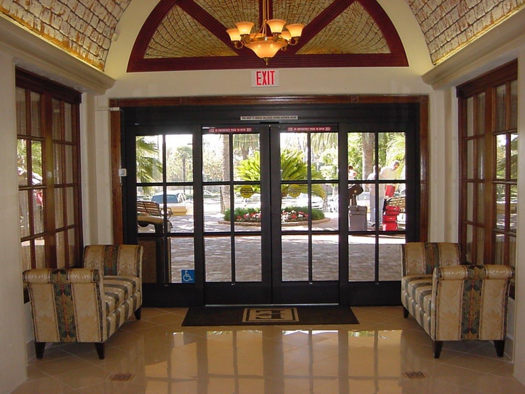 An exit with brown framed doors