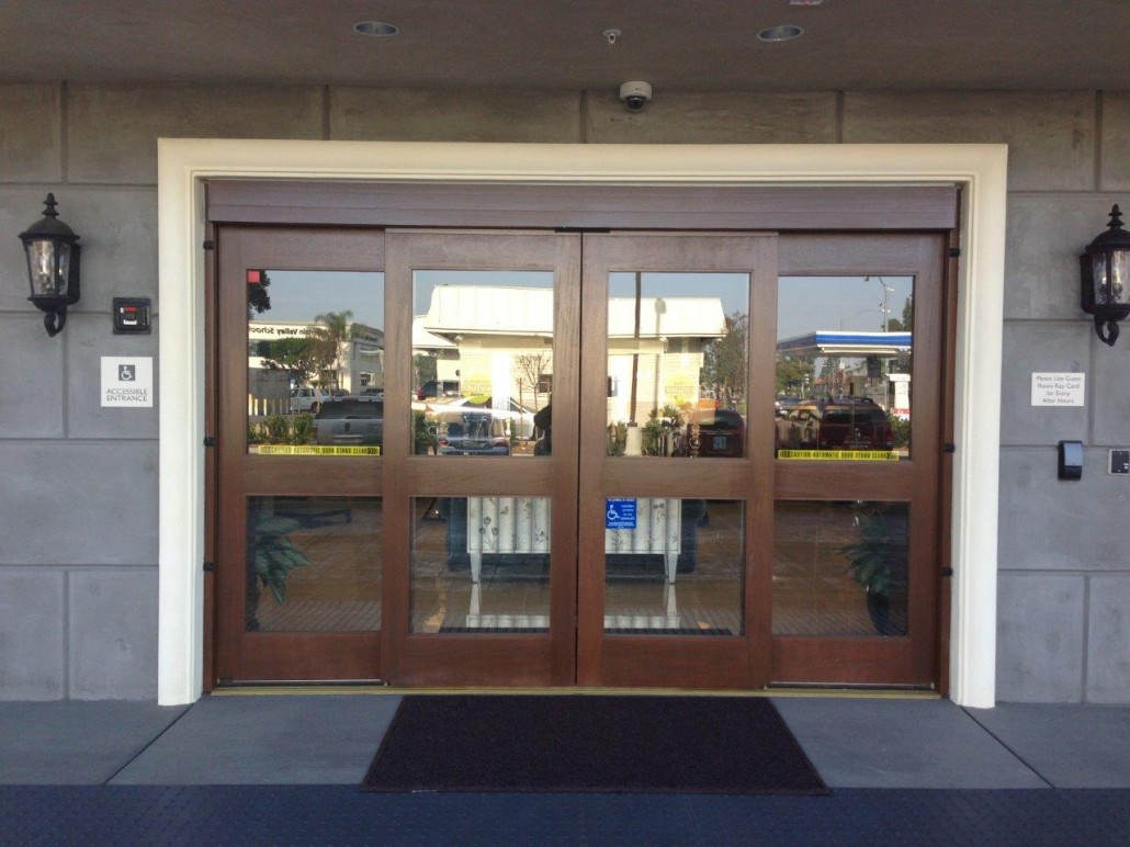 Large automated sliding doors with brown frames