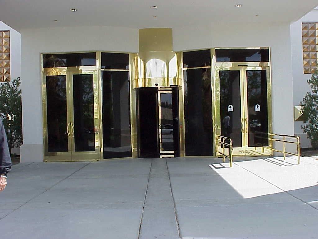 An entrance with black and gold doors