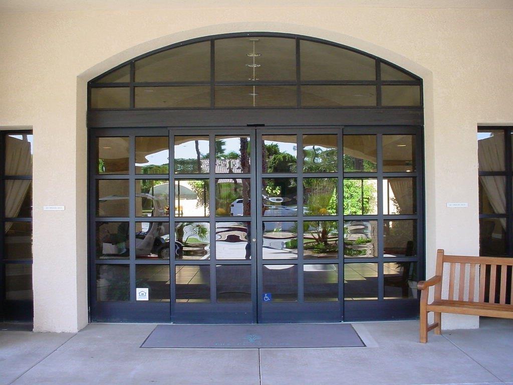 Two black doors with glass panes