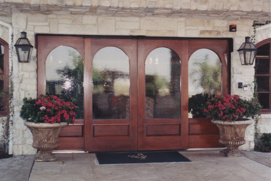 A wood door with blurry glass panes
